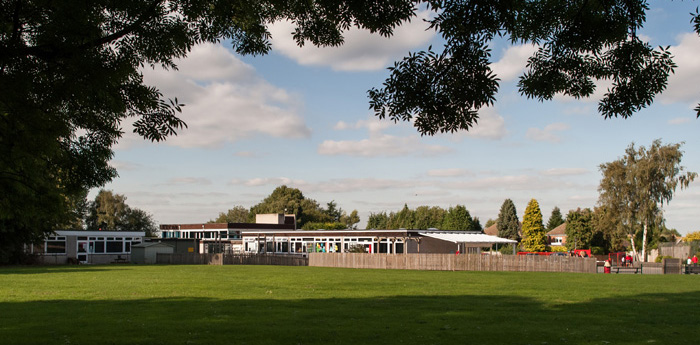 Landscape photo of the Hartley Primary Academy building and grounds.
