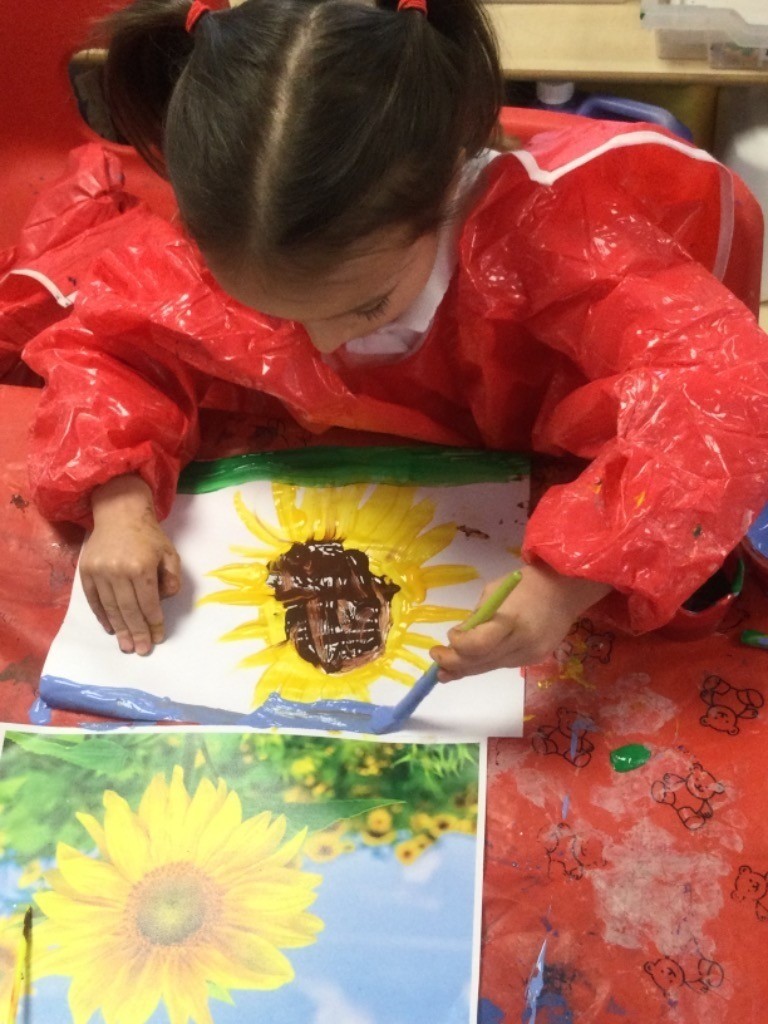 Nursery pupils are seen learning about the life cycle of plants by painting their own sunflowers.