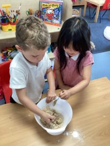 Nursery pupils are seen making cakes and cookies as part of Enterprise Week.
